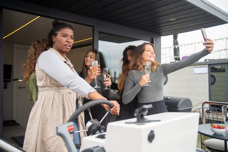 Woman With Champagne On Boat