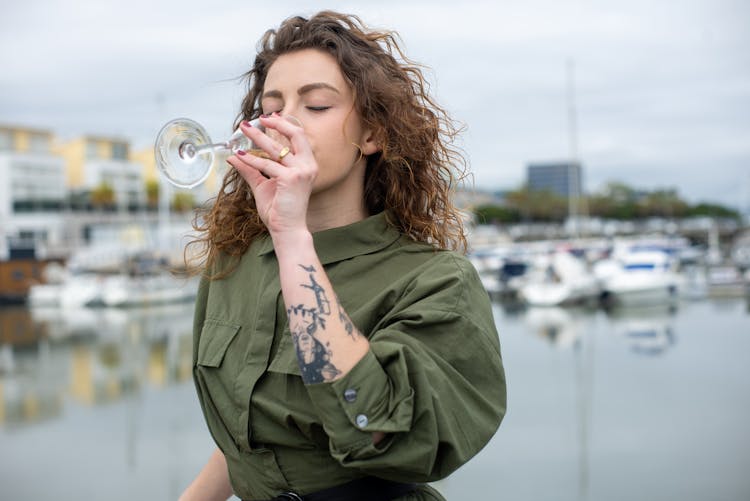 Beautiful Woman Drinking Wine In Marina