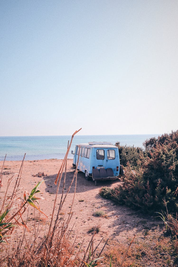 Retro Car Parked On Sandy Beach