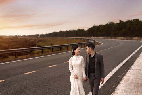 Free Portrait of Bride and Groom by Road Stock Photo