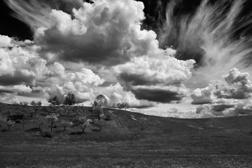 Free stock photo of black and white, dramatic sky, hill