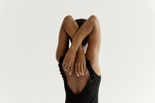 A Back View of a Woman in Black Tank Top