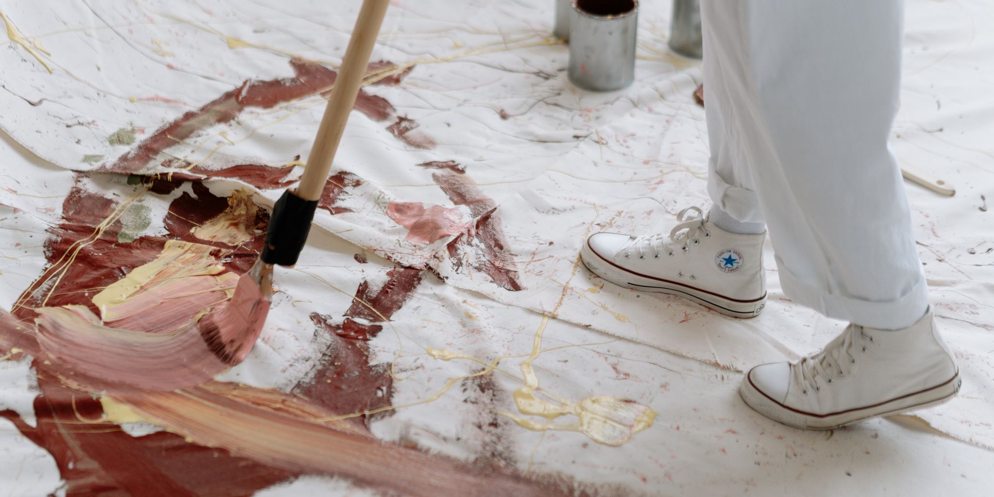 Artist working on a painting in a studio