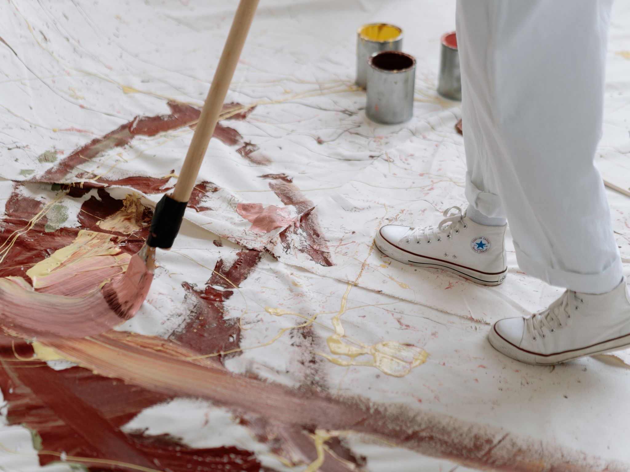 Artist working on a painting in a studio
