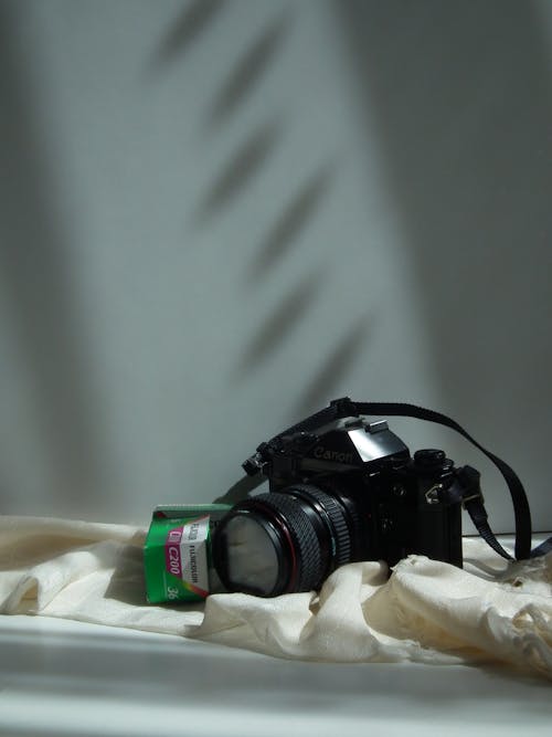 Black Camera on White Textile