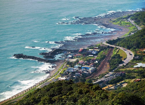 Aerial View of a Road Near Body of Water