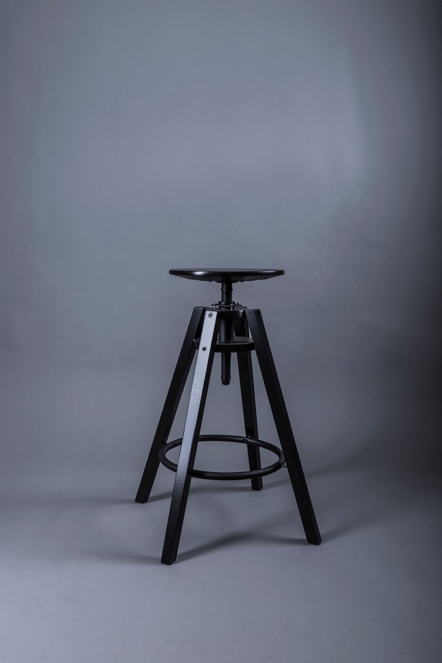 Black adjustable bar stool with metal legs — photo by Ahmet Atak on Pexels