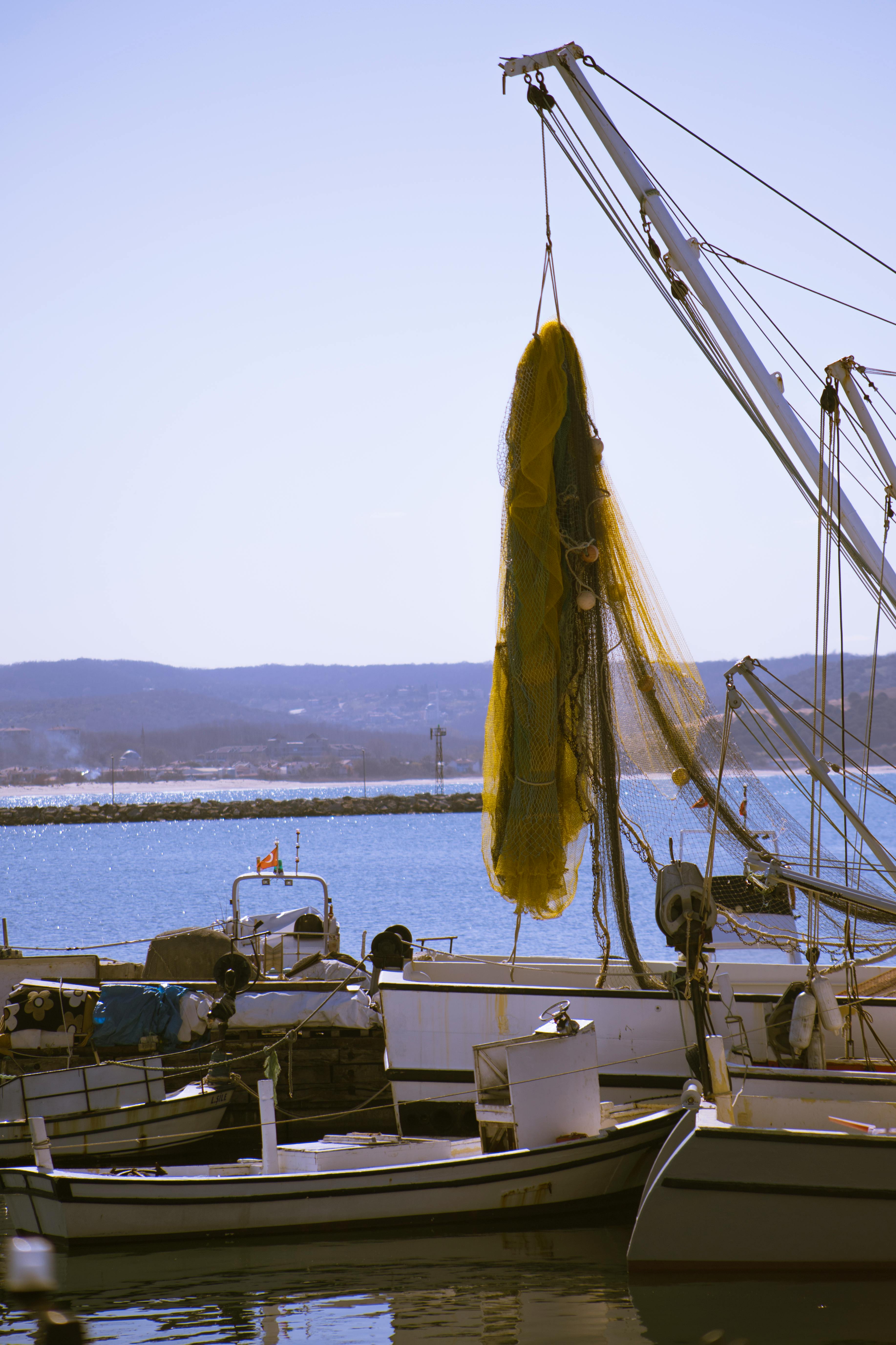 Fishing Net Hanging Above a Boat · Free Stock Photo
