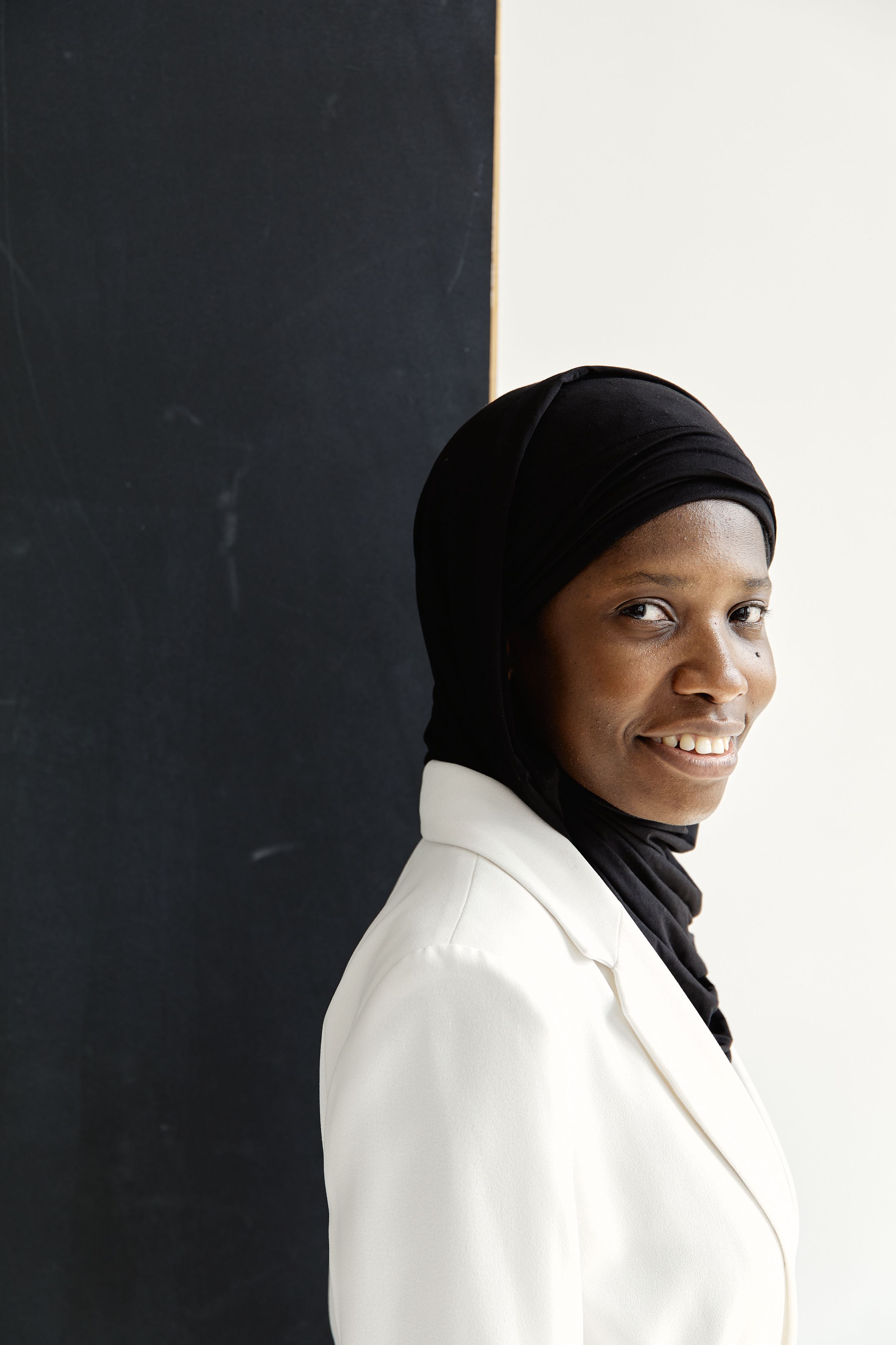 Portrait of a confident Muslim woman in a hijab, expressing positivity and elegance.