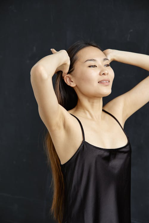 Close-Up Shot of a Woman in Black Tank Top