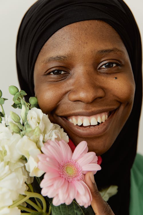 Smiling Woman Holding Flowers