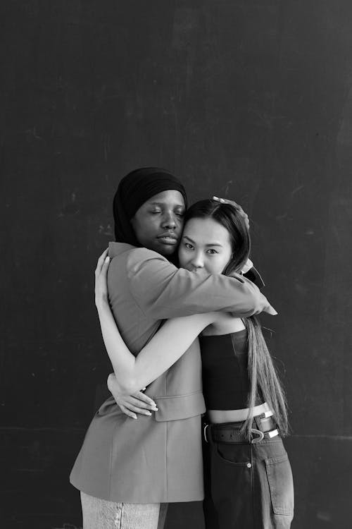 Women Hugging Each Other 