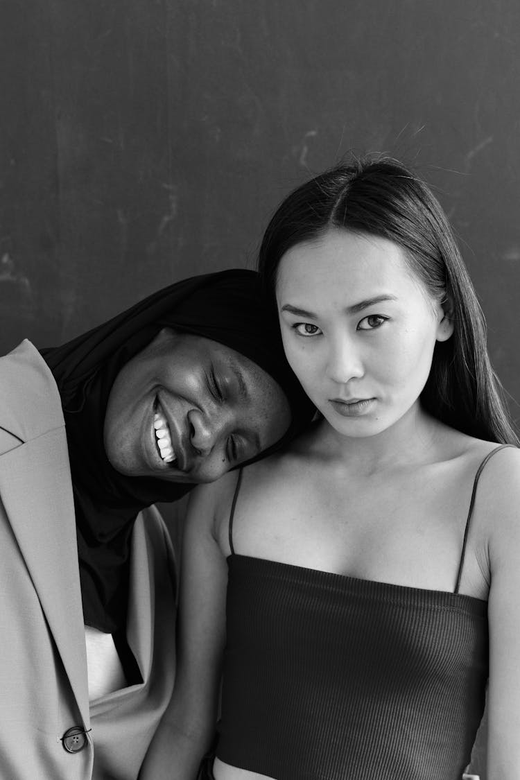 Portrait Of Smiling Women On Studio Background