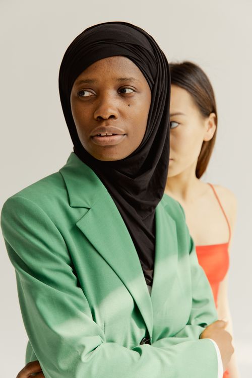 Free Portrait of two stylish women in contrasting outfits, symbolizing diversity. Stock Photo