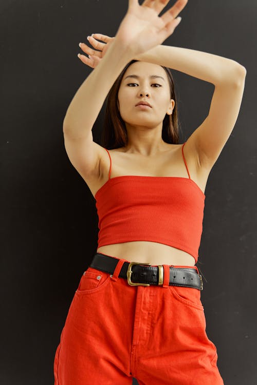 A Woman in Red Spaghetti Strap Top and Red Pants