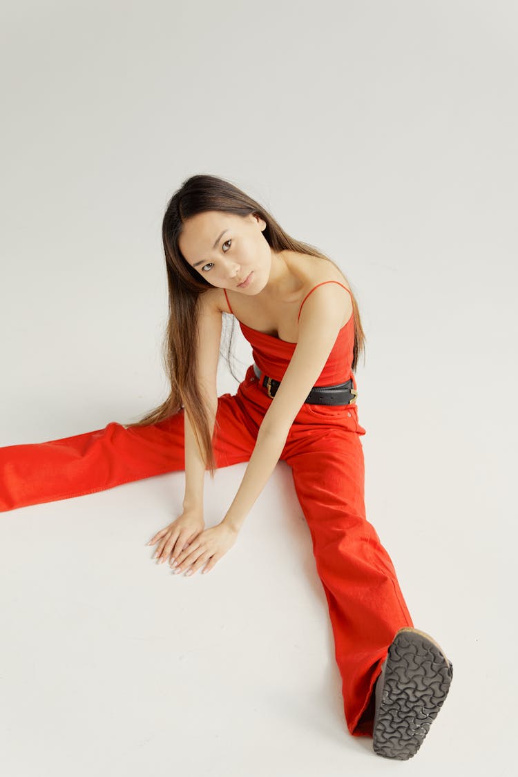 Woman In Casual Clothes Posing On White Studio Background