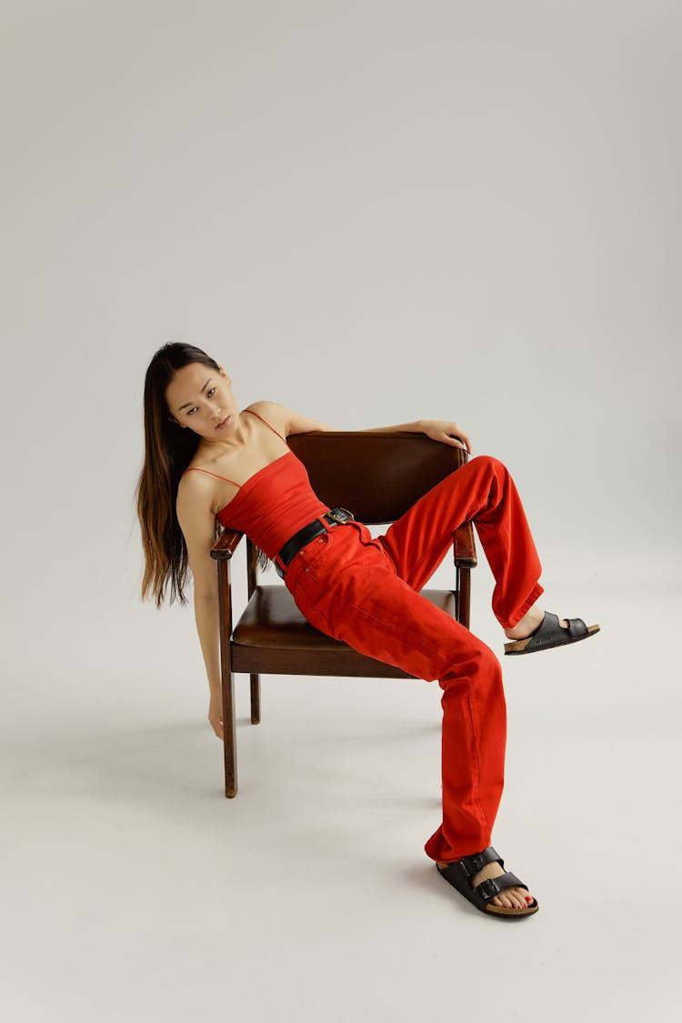 Woman In Red Pants And Red Top Wearing Sandals