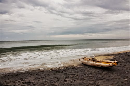 A Raft Beached on Seashore