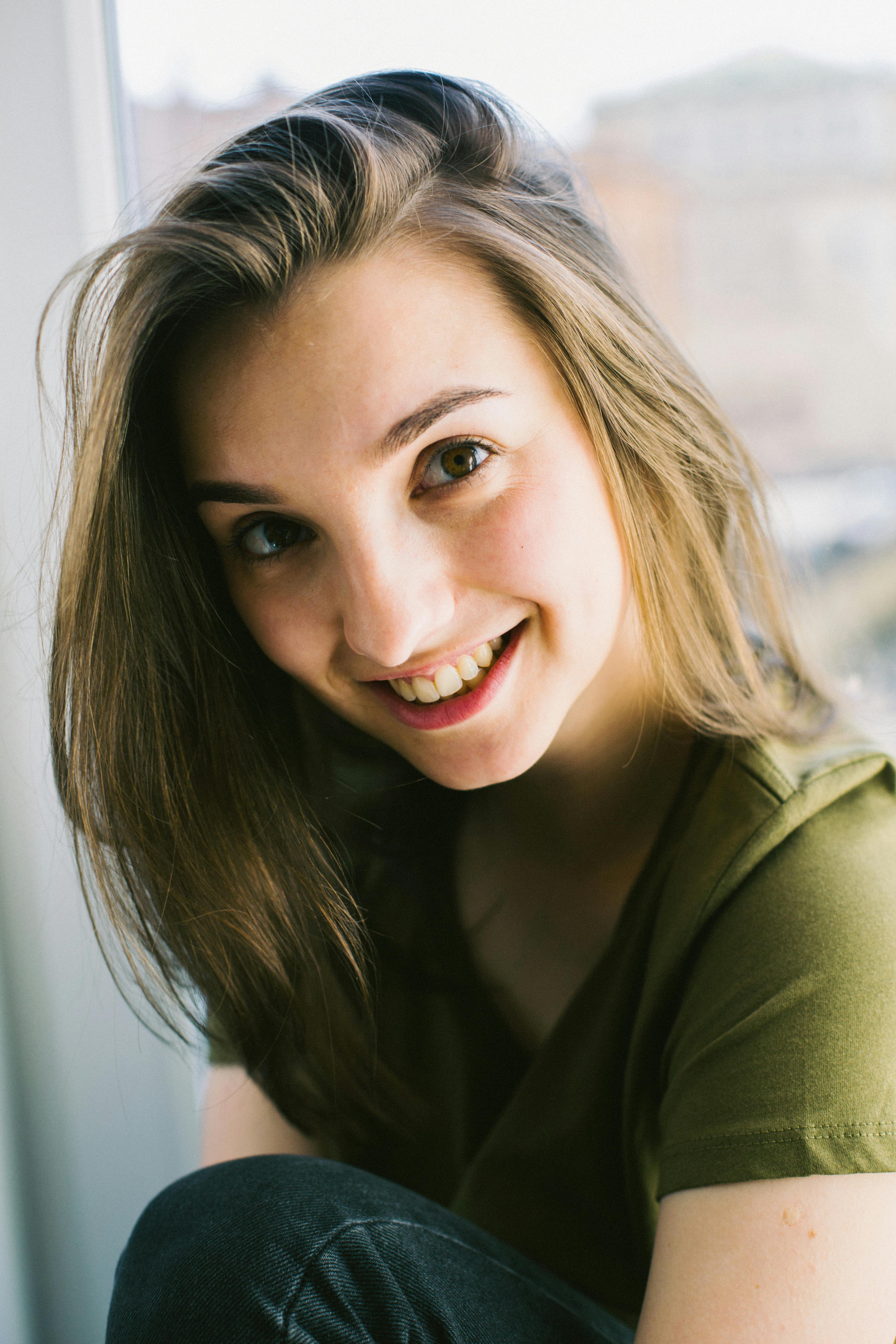 Close-Up Photography of a Smiling Woman · Free Stock Photo
