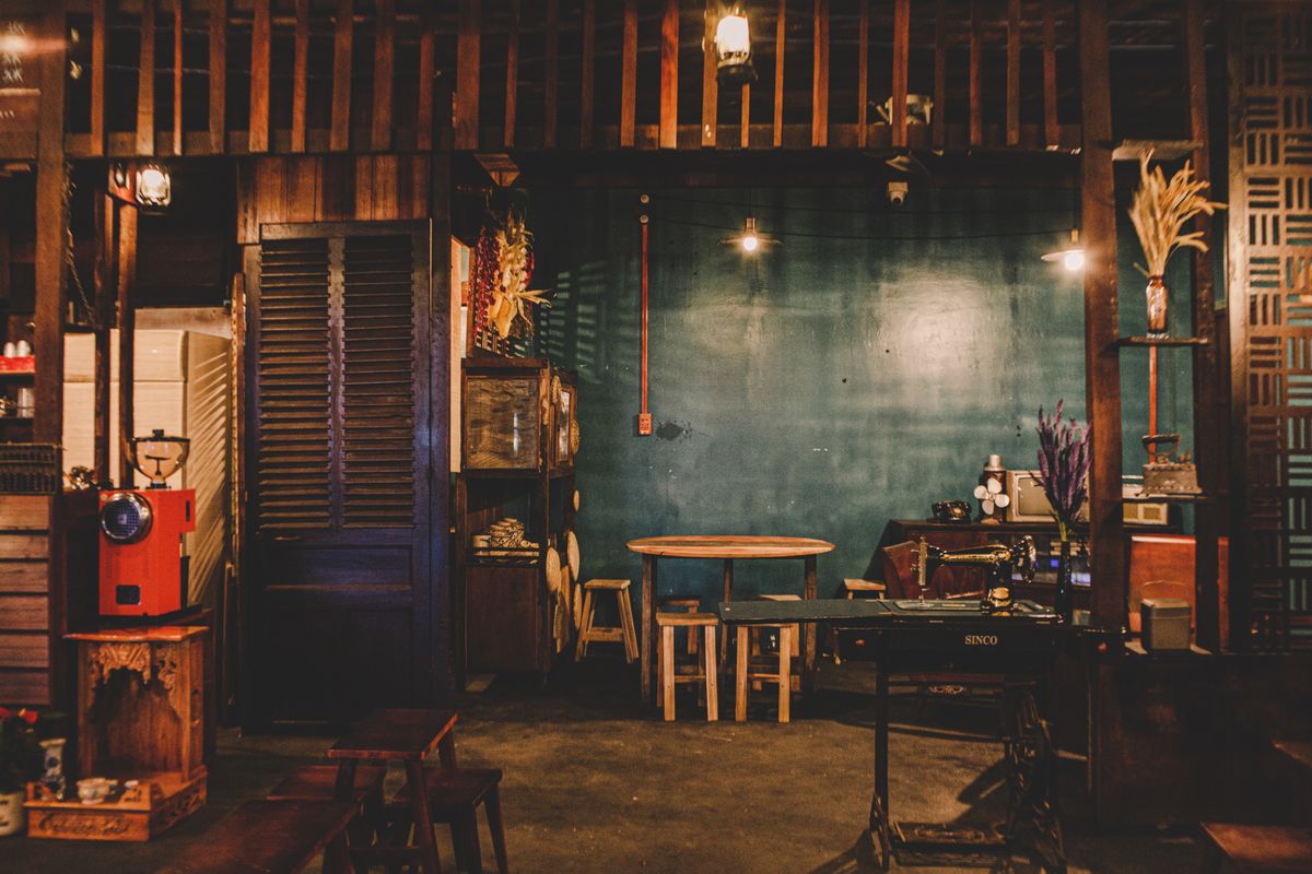 Warm rustic coffee shop interior with wooden furniture