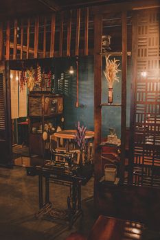 Warm rustic interior featuring vintage furniture and decor with soft lighting creating a cozy atmosphere.