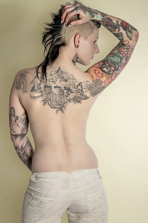A Woman With Tattoos on Her Back