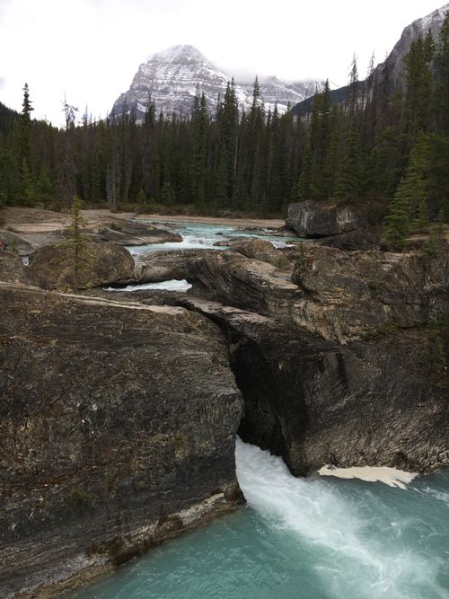 Free Captivating view of an emerald river flowing through rocky terrain in the Canadian Rockies. Stock Photo