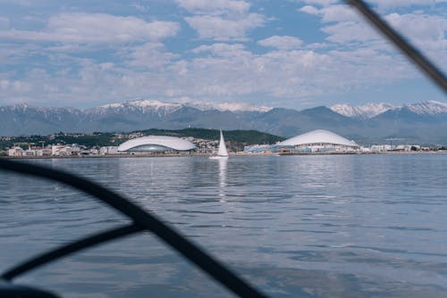 Stadium and Buildings in City on Shore