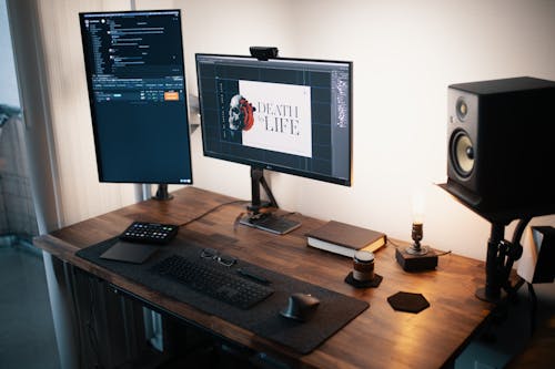 Computer Set on Brown Wooden Table