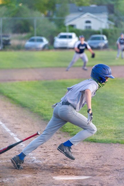 baseball player walking to first base