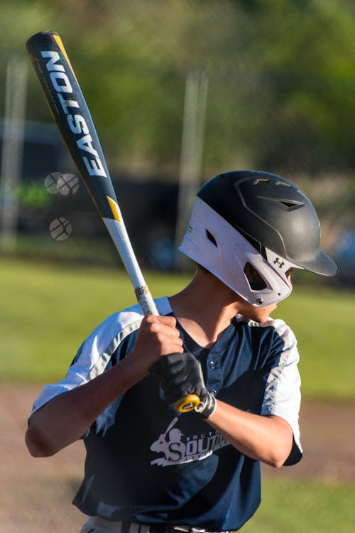 Boy Wearing Helmet Holding Baseball Bat 