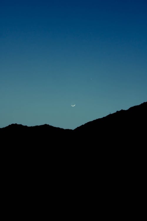 Free Silhouette of Mountain Under Blue Sky during Night Time Stock Photo
