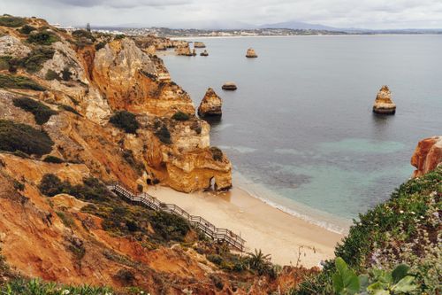 Free Breathtaking view of Algarve's cliffs and beach in Portugal. Pristine nature and scenic beauty. Stock Photo