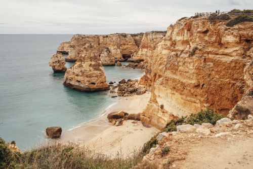 Free Experience the breathtaking coastal cliffs and turquoise waters - a natural masterpiece captured in serene perfection. Stock Photo
