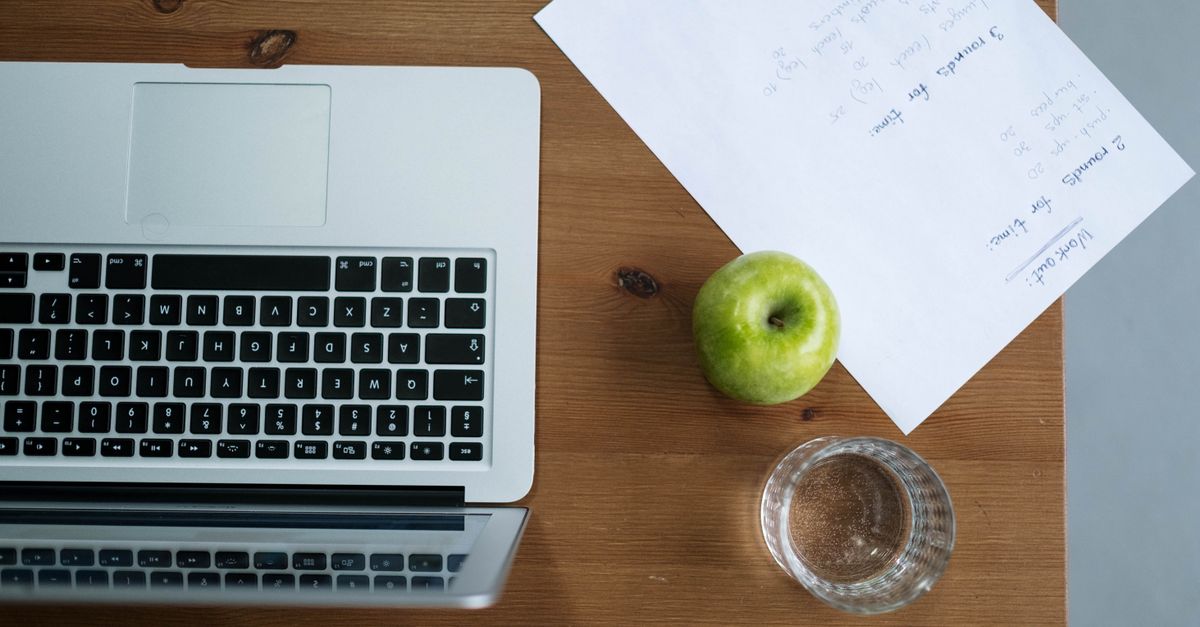 healthy snacks and water on a desk in a Ho office setting