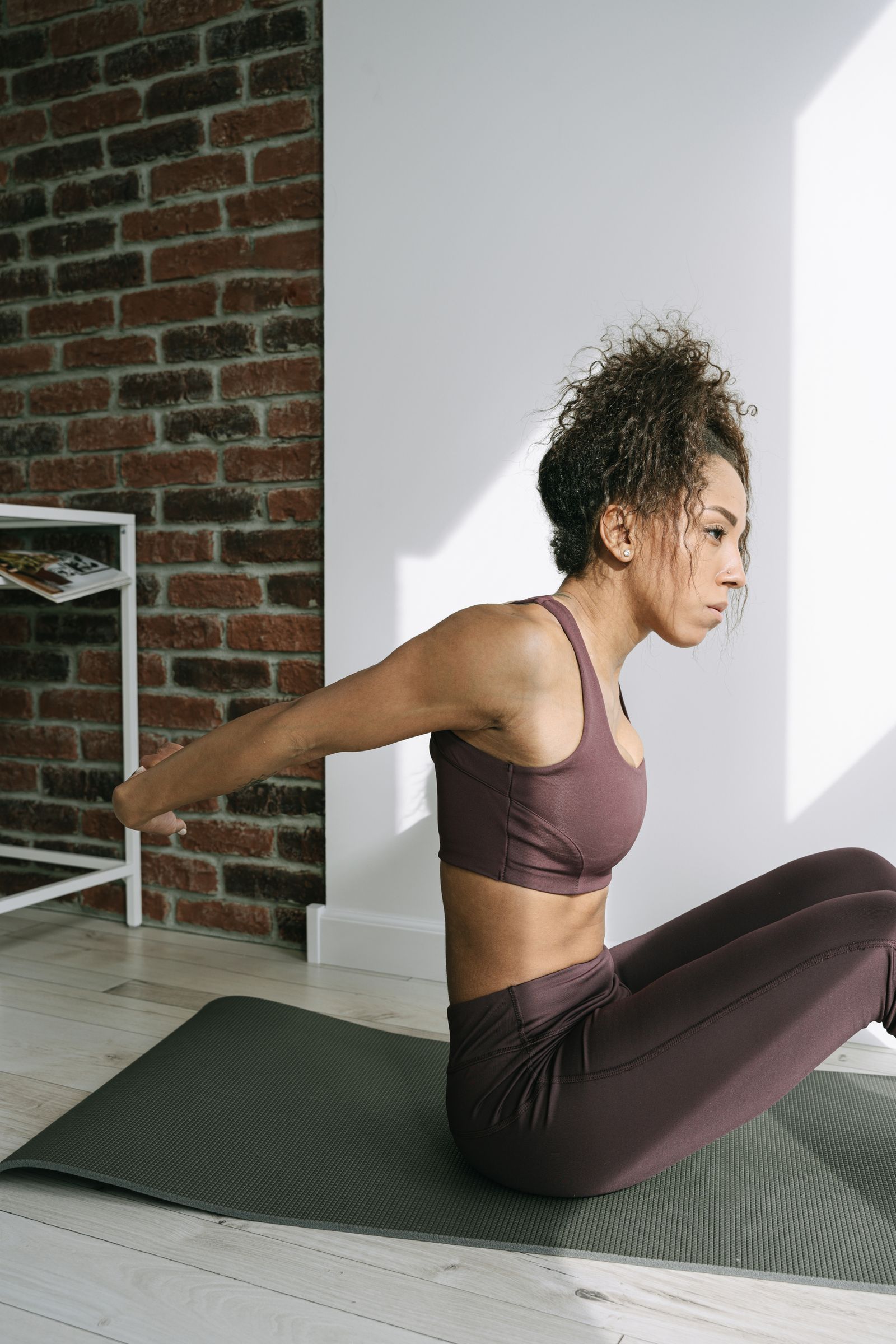 Gentle at-home yoga stretches Woman stretching during a gentle yoga practice