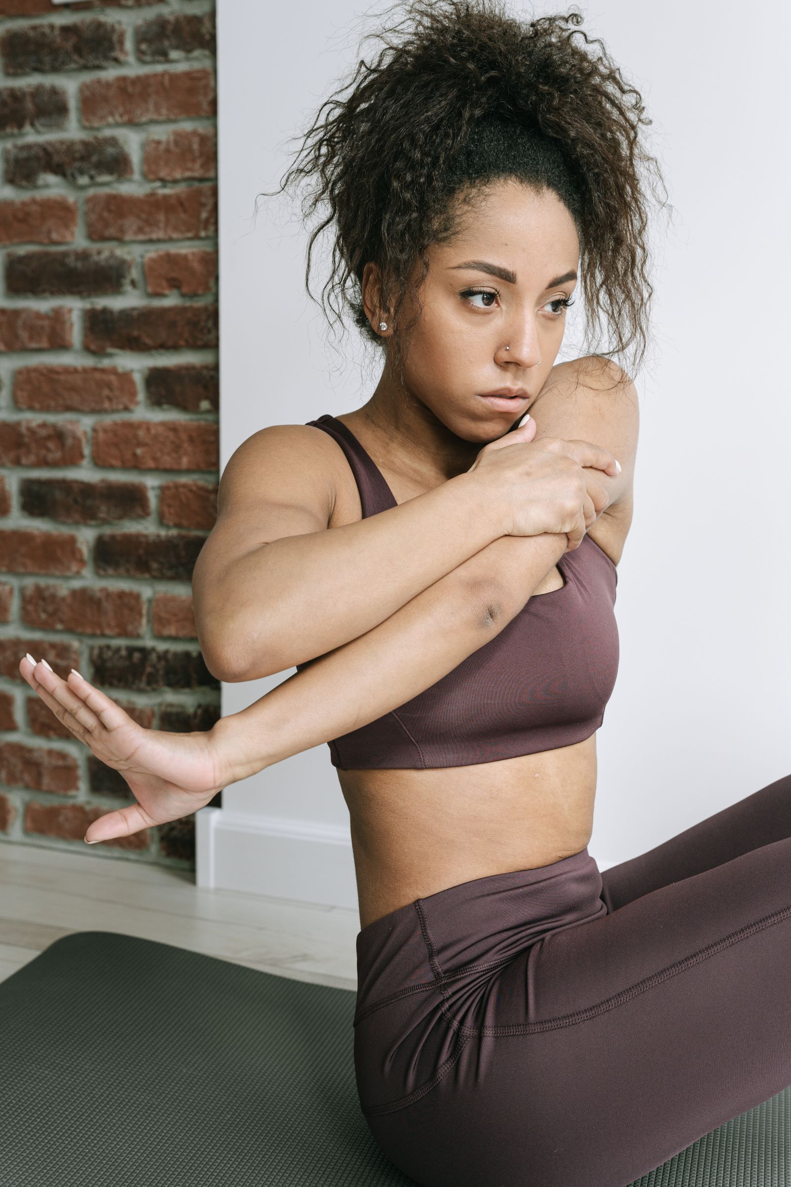 Yoga stretch with visible hand wrist and arm for wrist support context