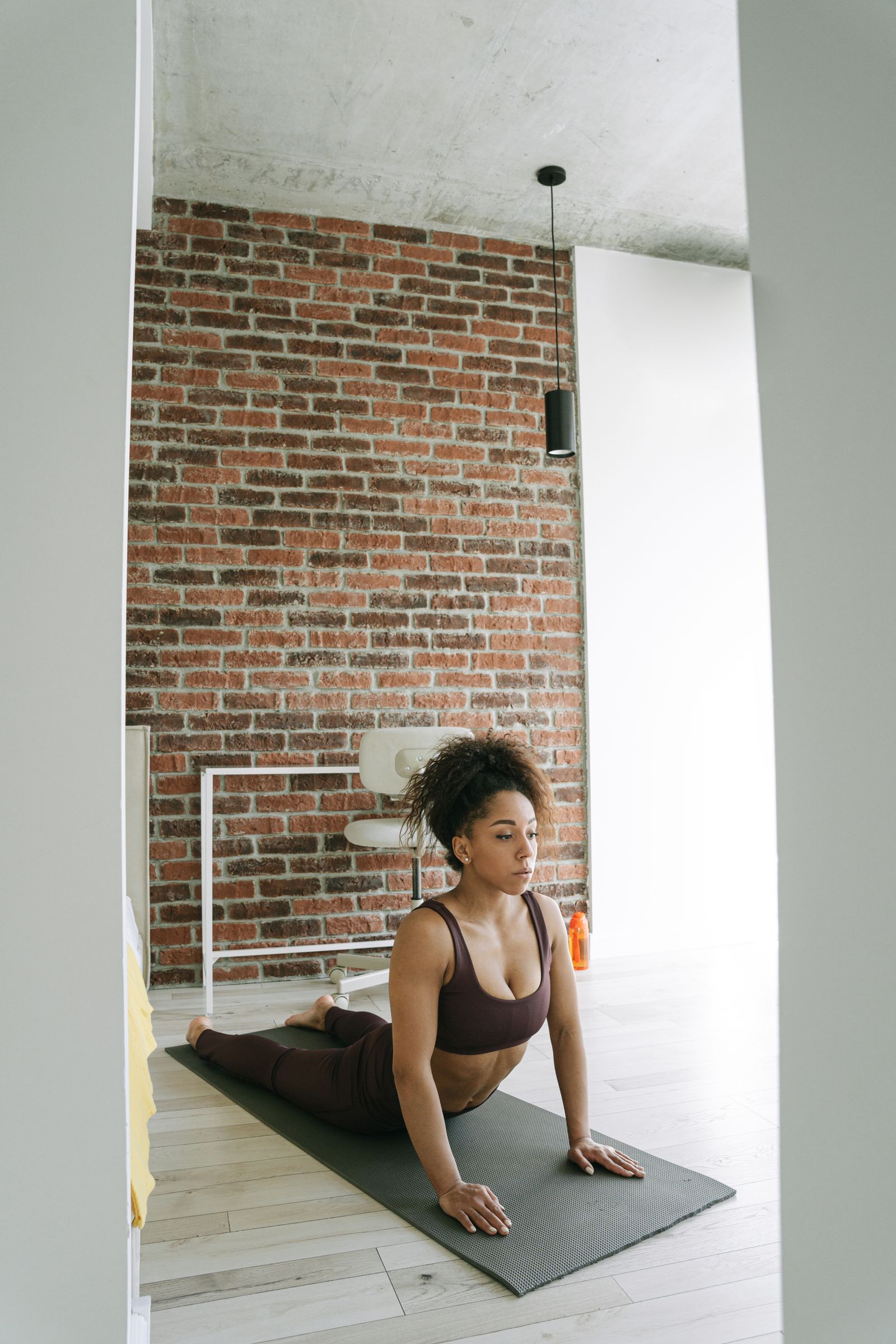 Cobra pose with mindful movement Woman practicing cobra pose on a yoga mat