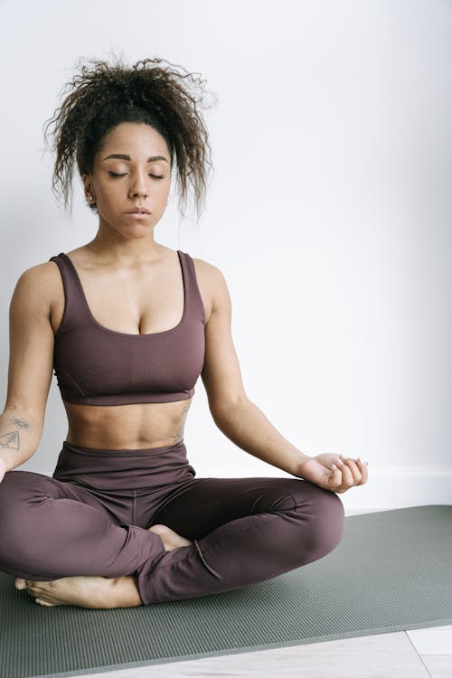 Woman on Lotus Pose on a Yoga Mat