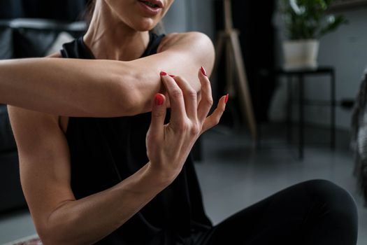 Woman in Black Tank Top With Red Manicure