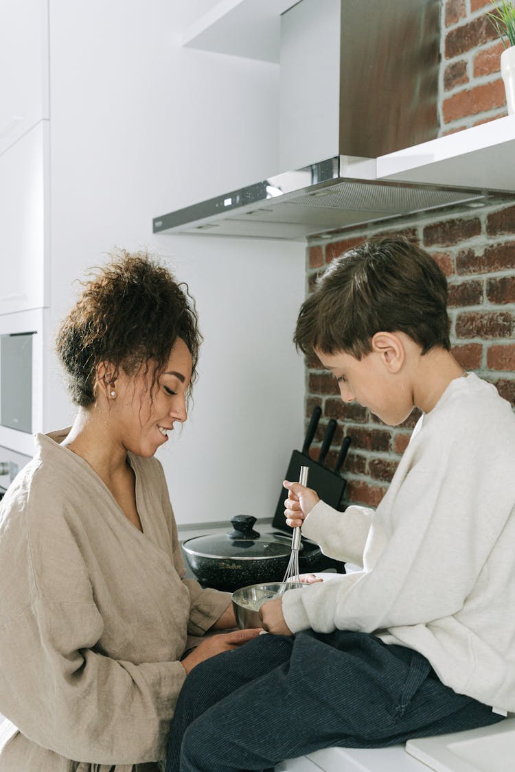 Mother And Son Cooking In The Kitchen