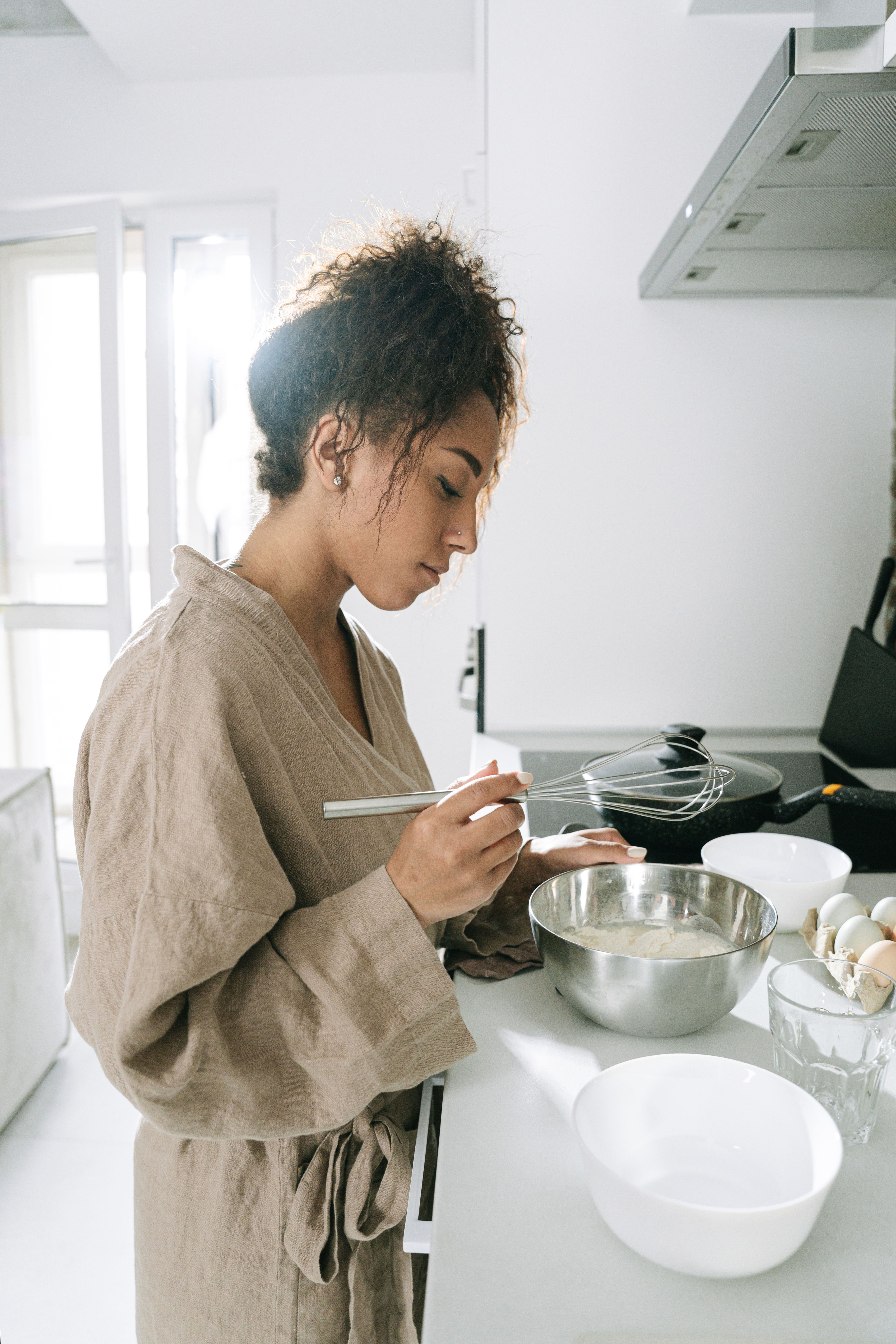 A Woman Cooking at the Kitchen · Free Stock Photo
