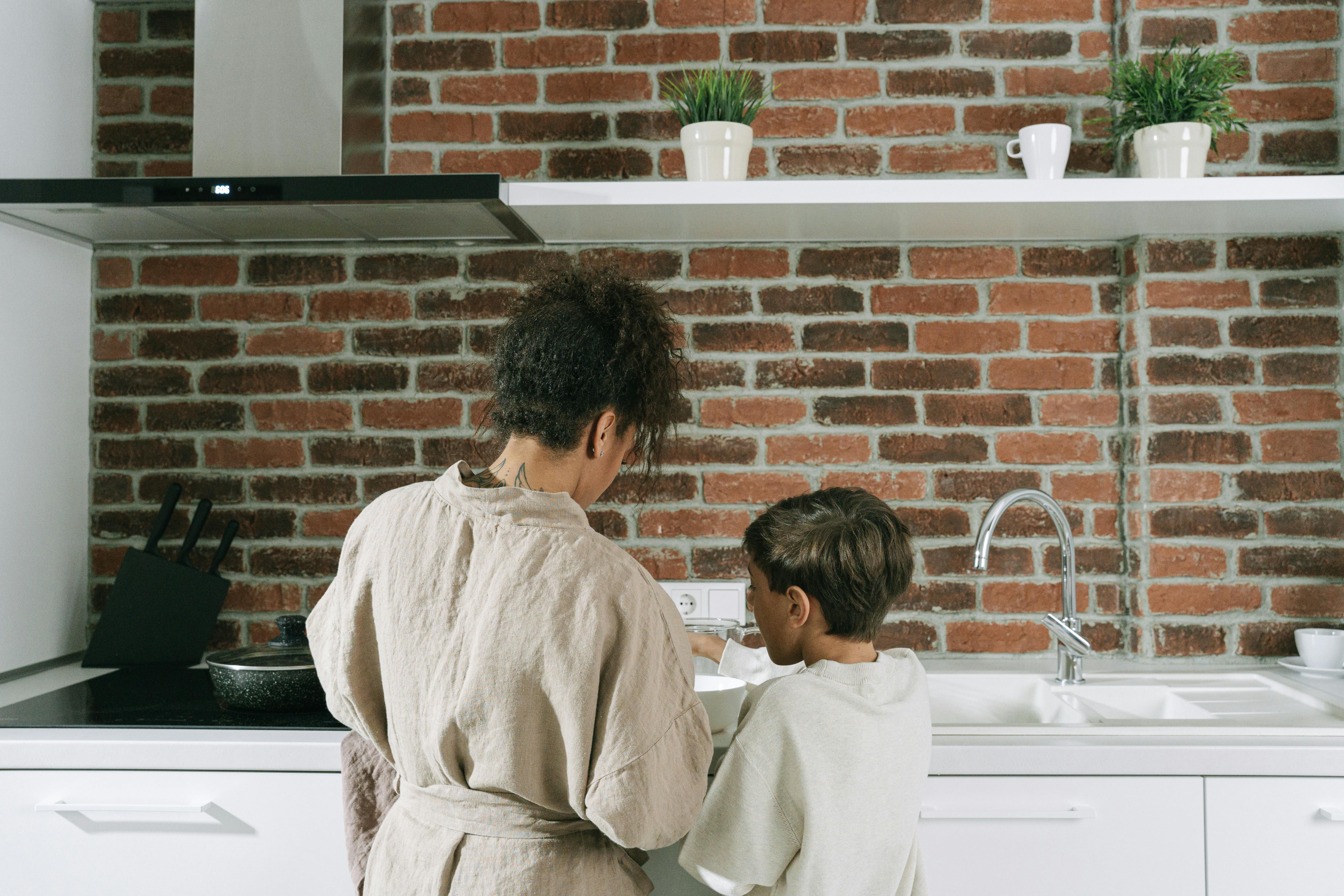 mother and son cooking at the kitchen