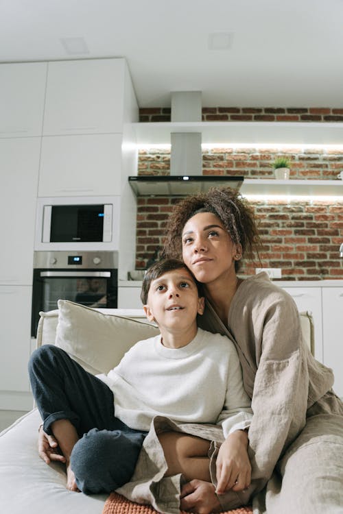 Mother and Son Watching Television Together 