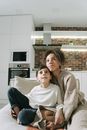 Woman in Gray Sweater Sitting Beside Woman in Gray Sweater