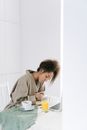 Woman in Gray Shirt Sitting on Chair