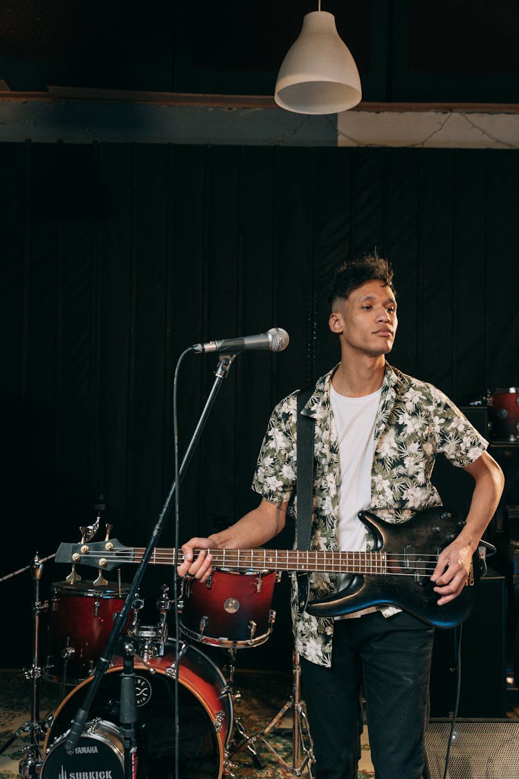 Man Playing An Electric Guitar On Stage