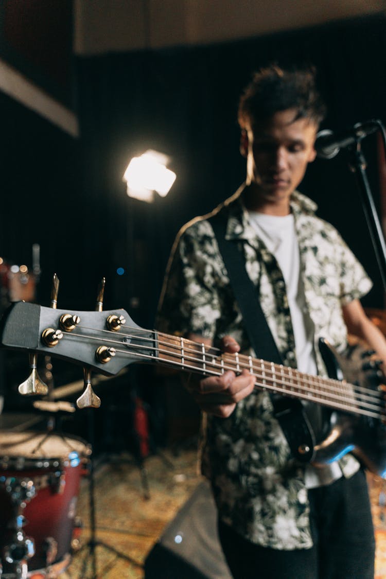 
A Man Playing A Bass Guitar