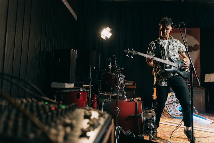 
A Man Playing A Bass Guitar