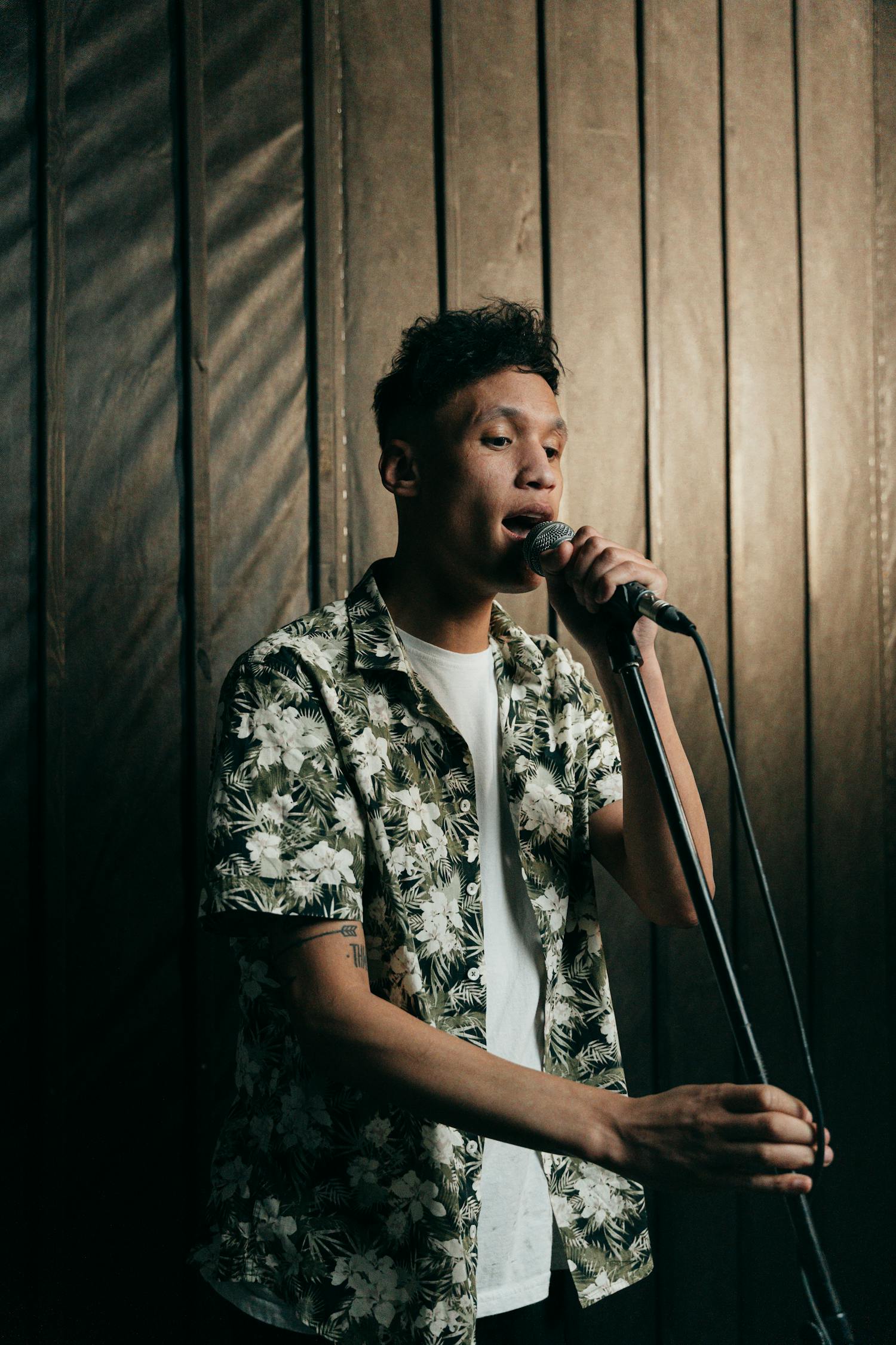 Male performer singing on stage